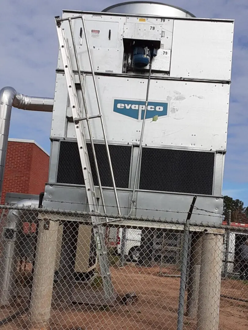 A large air conditioning unit with a ladder attached to it.